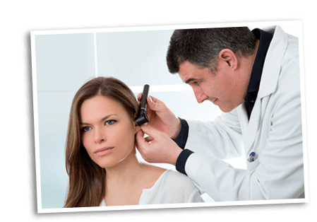 Doctor examining a patients ear