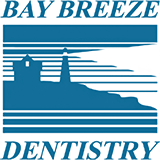 Bay Breeze Dentistry Logo - Dark blue serif type with lighthouse icon in middle