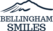 Bellingham Smile Logo - Dark blue serif type with mountain icon on top