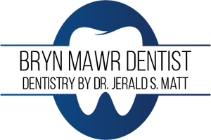 Brite Smiles Dental Care Logo - Black sans-serif type with navy blue oval in background with shape of tooth in center
