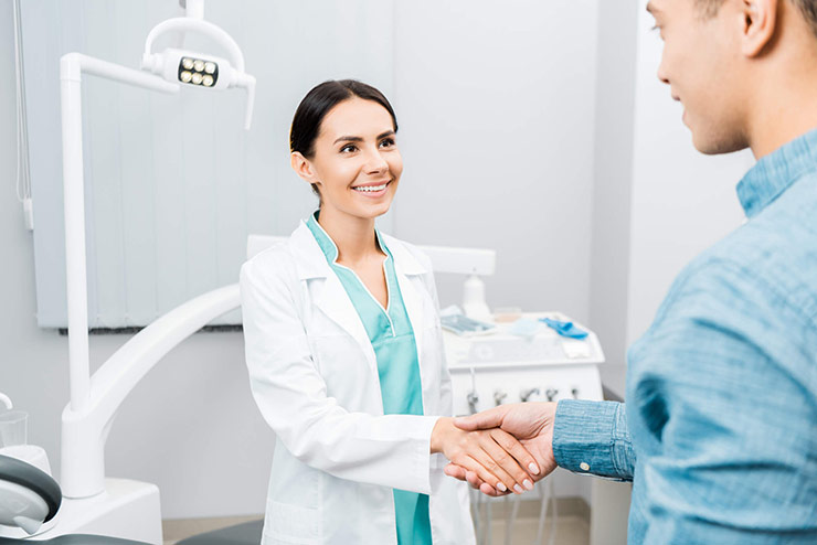 Doctor shaking hands with patient