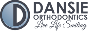 Dansie Orthodontics Logo - Dark blue script and sans-serif type with circle and letter D inside to left