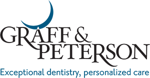 Graff and Peterson Dental Logo - Black serif type with blue sans-serif tagline and blue crescent moon on top