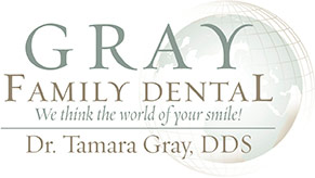 Gray Family Dental Logo - Muted green and brown serif type with stylized globe in background