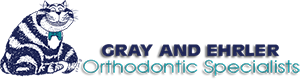 Gray and Ehrler Orthodontics Logo - Dark blue and turquoise sans-serif type with cat illustration to left