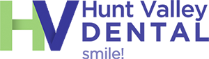 Hunt Valley Dental Logo - Purple serif type with purple and green HV to left