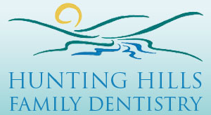 Hunting Hills Family Dentistry Logo - Blue serif type with mountain icon on top