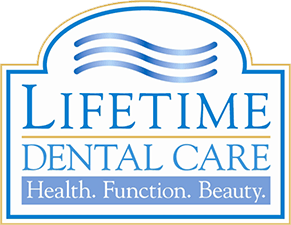 Lifetime Dental Care Logo - Blue and white serif type with white and gold border