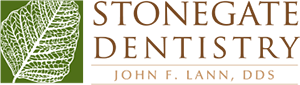 Stonegate Dentistry Logo - Brown and tan serif type with green leaf to left