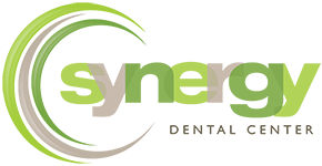 Synergy Dental Logo - Green and gray sans-serif type with circular swooshes to left