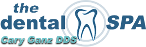 The Dental Spa Logo - Dark blue sans-serif type with tooth in middle