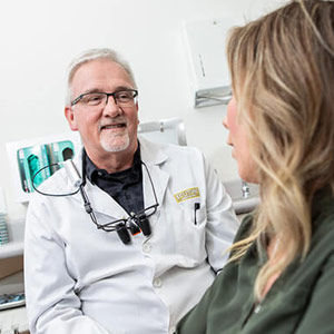 Wayne Kinney talking with a patient