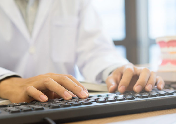 Person typing on a laptop