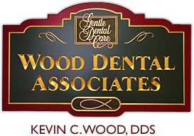 Wood Dental Associates Logo - Gold serif type engraved into plaque with dark red border